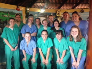 students wearing scrubs to help with a health clinic