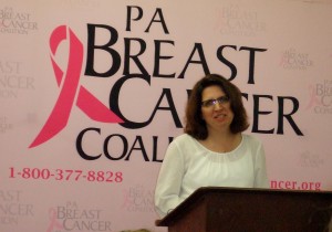 Ann Marie Potter speaks at a  Breast Cancer Survivors' Exhibit 